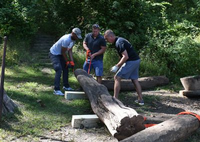 workers moving a log