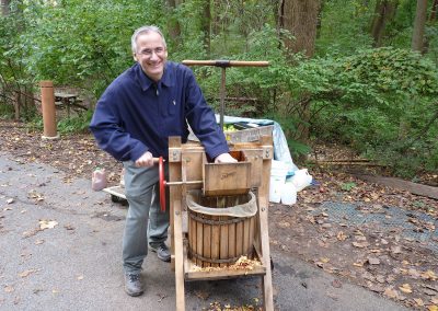 man grinding fruit